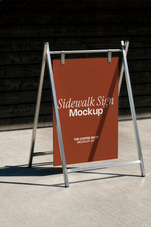 A-frame sidewalk sign mockup styled outdoors on a café sidewalk. Blank sandwich board sign mockup ready for your coffee shop branding design. Sidewalk sign mockup, A-frame mockup, signage mockup, coffee shop mockup, café mockup, storefront mockup, high quality mockup, PSD file.