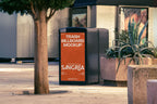 Real photo trash bin billboard mockup PSD in city plaza with natural light and plants