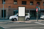 Real photo citylight street billboard mockup PSD at intersection with natural light and passing cars