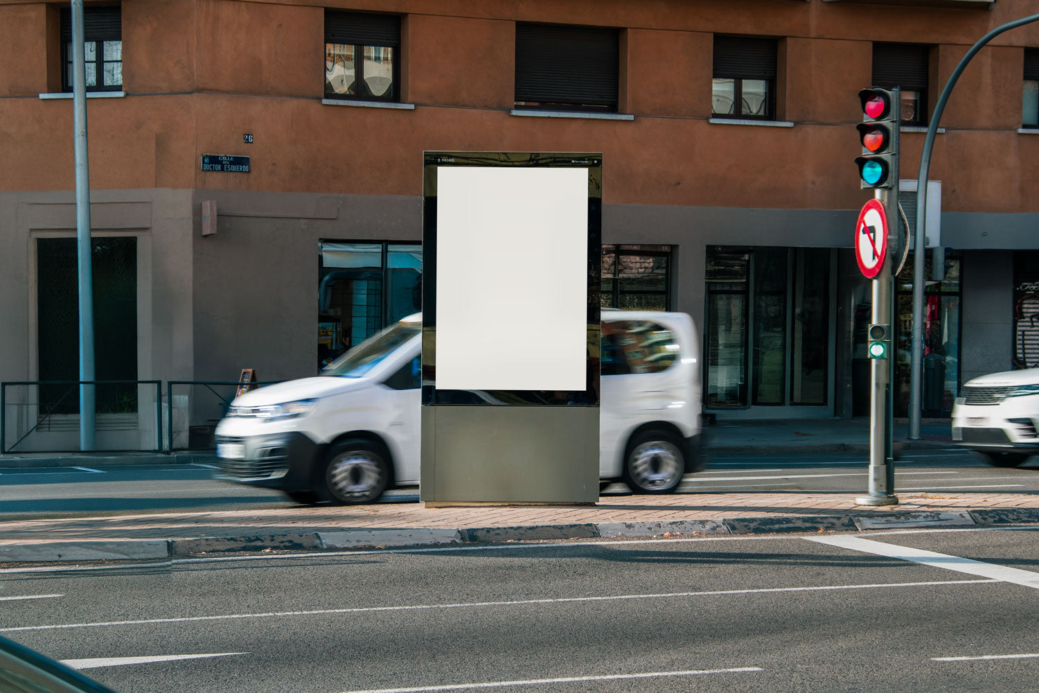 Real photo citylight street billboard mockup PSD at intersection with natural light and passing cars