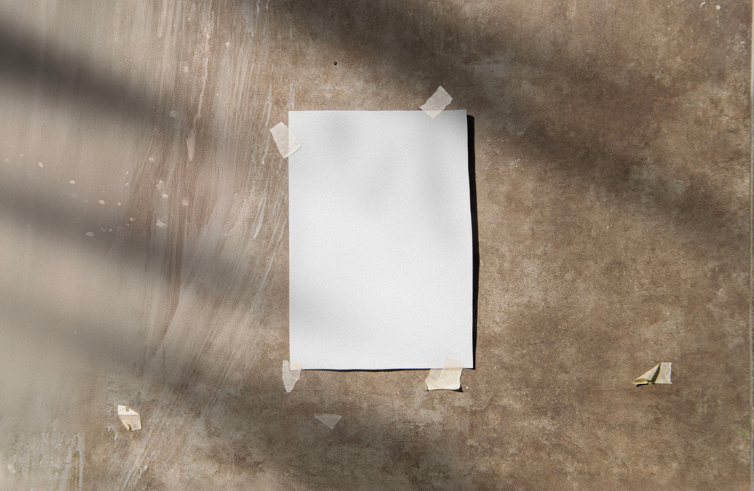 Real photo taped print poster mockup on textured wall with natural shadows (paper grain visible)