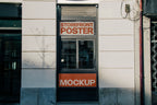 Real photo storefront poster mockup PSD on shop window with natural reflections and shadows