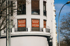 Real photo corner building billboard mockup PSD with natural light and city architecture