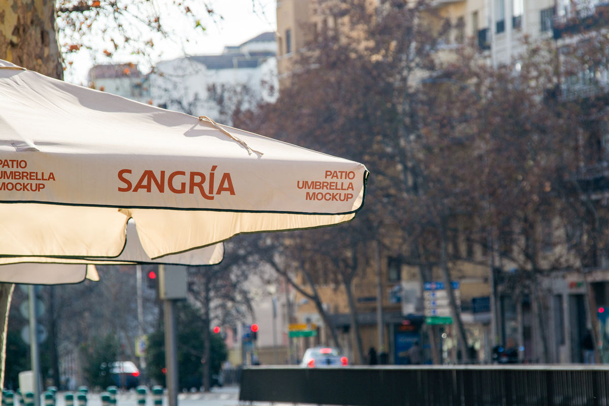 Real photo patio umbrella mockup PSD with logo area on fabric under natural light, city background
