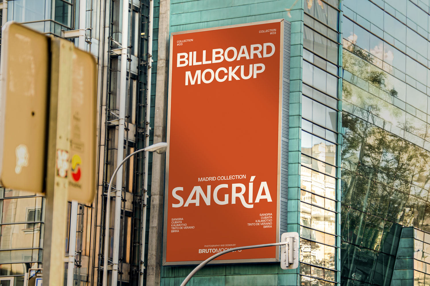 Real photo billboard mockup PSD on glass building with city reflections
