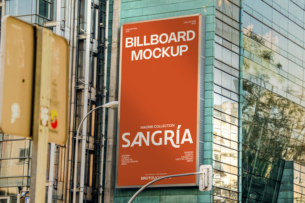 Real photo billboard mockup PSD on glass building with city reflections
