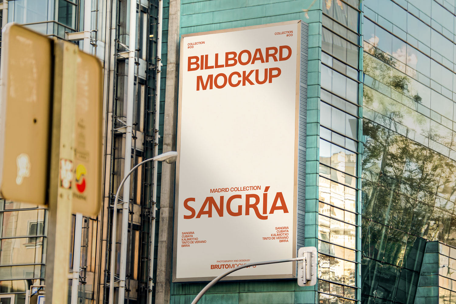 Real photo billboard mockup PSD on glass building with city reflections
