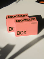 box packaging mockup PSD with two stacked paper boxes on sunlit desk and plant shadows